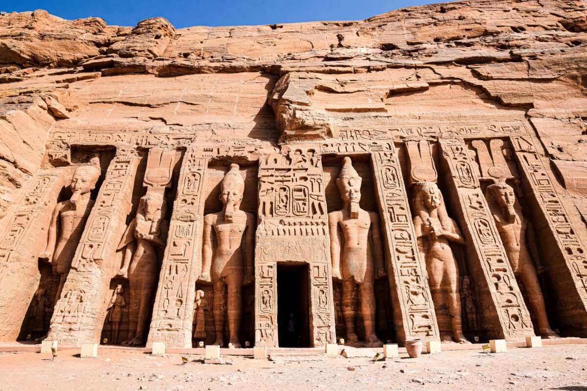 Explore the magnificent carvings at the entrance of the ancient Egyptian temple in Abu Simbel.