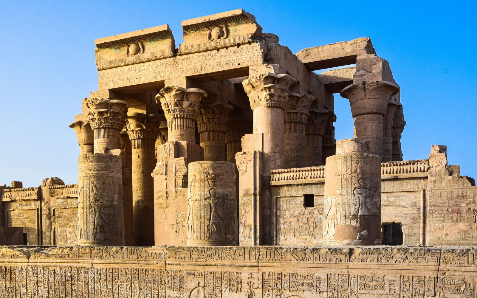 Explore the majestic ancient ruins of Kom Ombo Temple with intricate carvings.