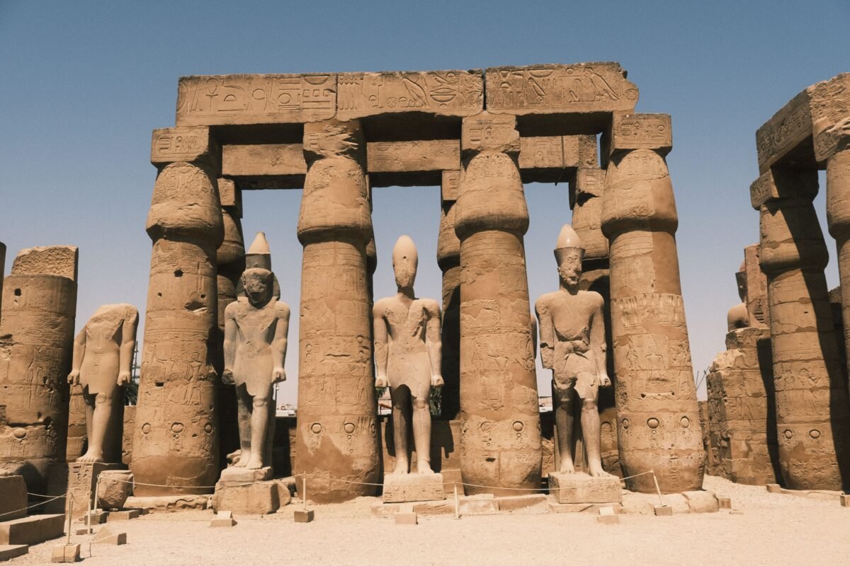 Explore the grandeur of Karnak Temple's ancient columns and statues in Luxor, Egypt.