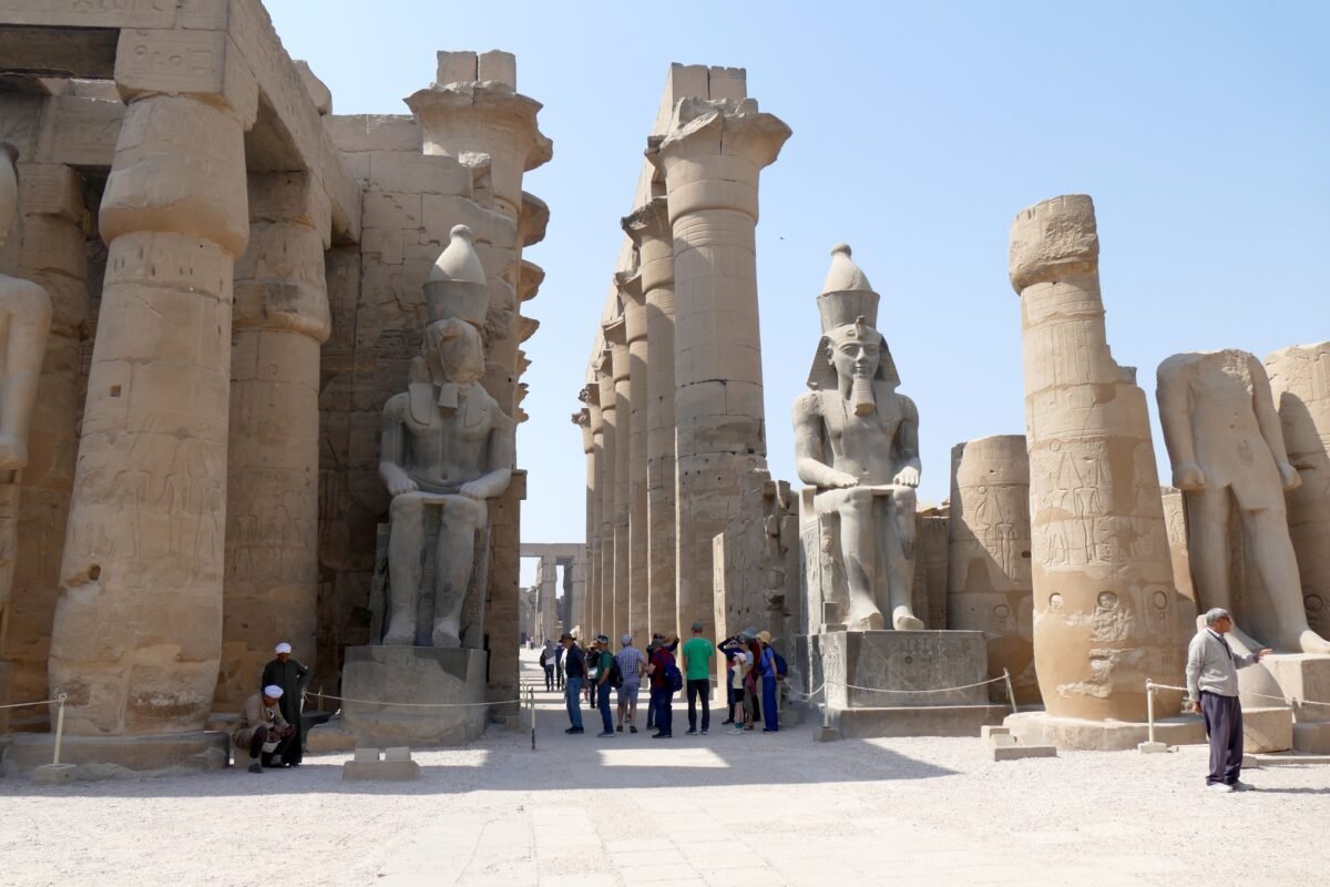 Explore the grandeur of the ancient Luxor Temple ruins in Egypt on a sunny day.